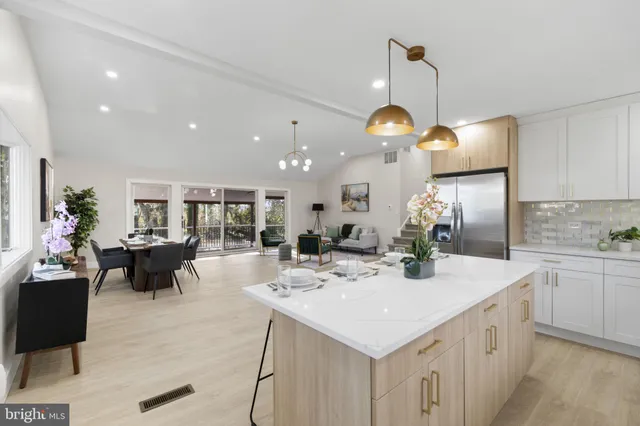 a view of kitchen island a sink and living room