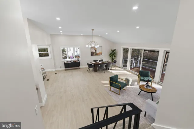a dining room with furniture and a chandelier