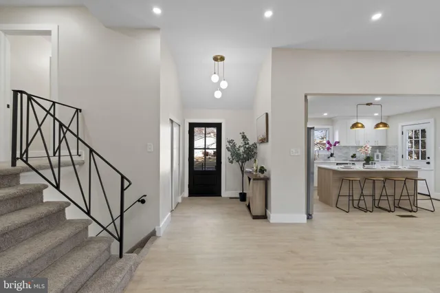 a view of a livingroom with furniture and hardwood floor