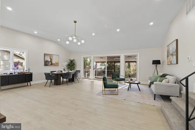 a living room with furniture and white walls