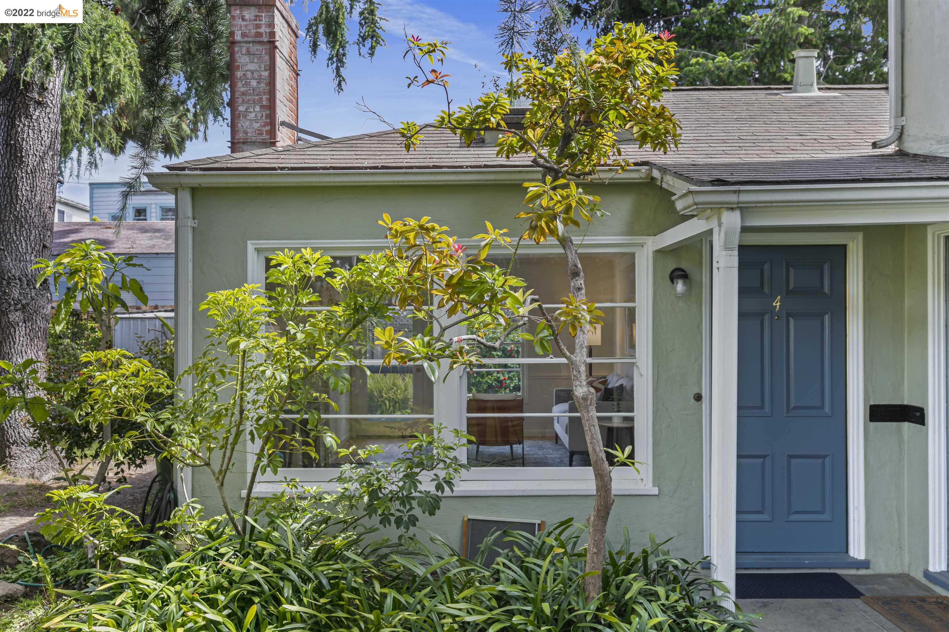 1732 Hearst Avenue, Unit 4 Berkeley, CA 94703 - Photo 1 of 1 a view of a house with a small yard and plants