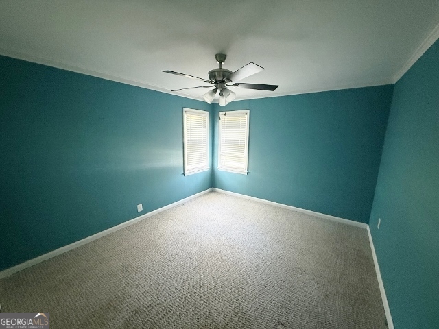 451 Lambs Bridge Road Swainsboro, GA 30401 - Photo 16 of 23 a view of a big room with windows and chandelier fan