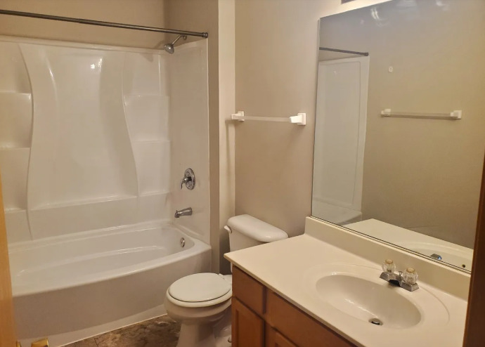 1449 McClure Road, Unit 1449 Aurora, IL 60505 - Photo 11 of 25 a bathroom with a sink toilet and shower