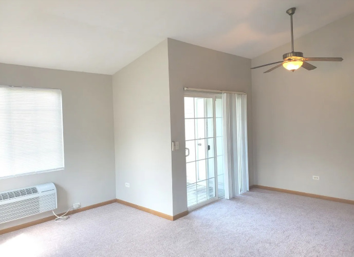 1449 McClure Road, Unit 1449 Aurora, IL 60505 - Photo 15 of 25 a view of an empty room with a window