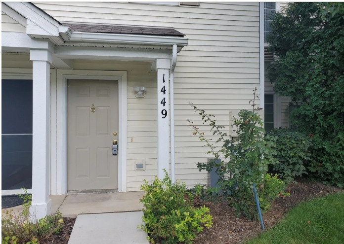 1449 McClure Road, Unit 1449 Aurora, IL 60505 - Photo 2 of 25 a view of a house with potted plants