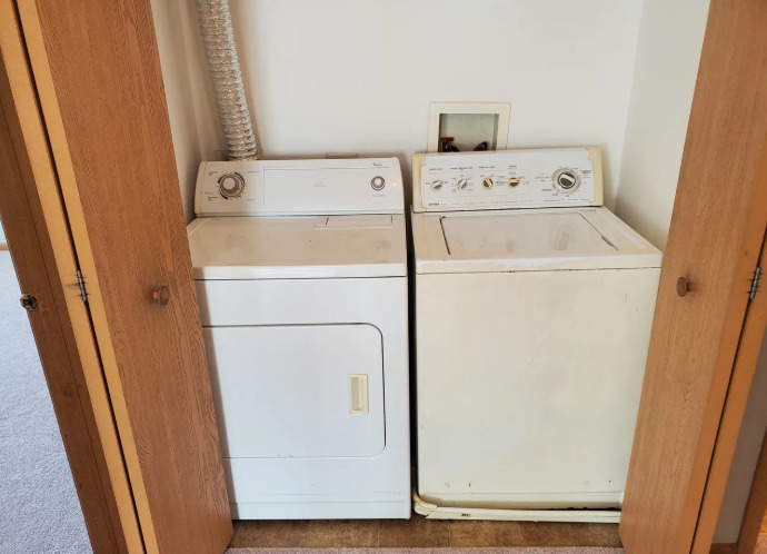 1449 McClure Road, Unit 1449 Aurora, IL 60505 - Photo 4 of 25 a utility room with dryer and washer