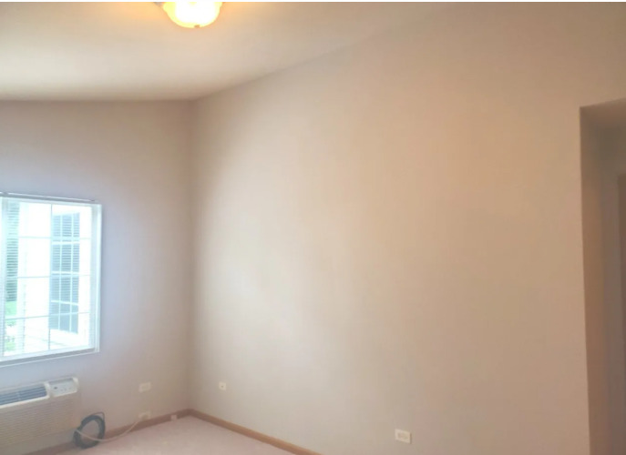 1449 McClure Road, Unit 1449 Aurora, IL 60505 - Photo 8 of 25 a view of an empty room with a window