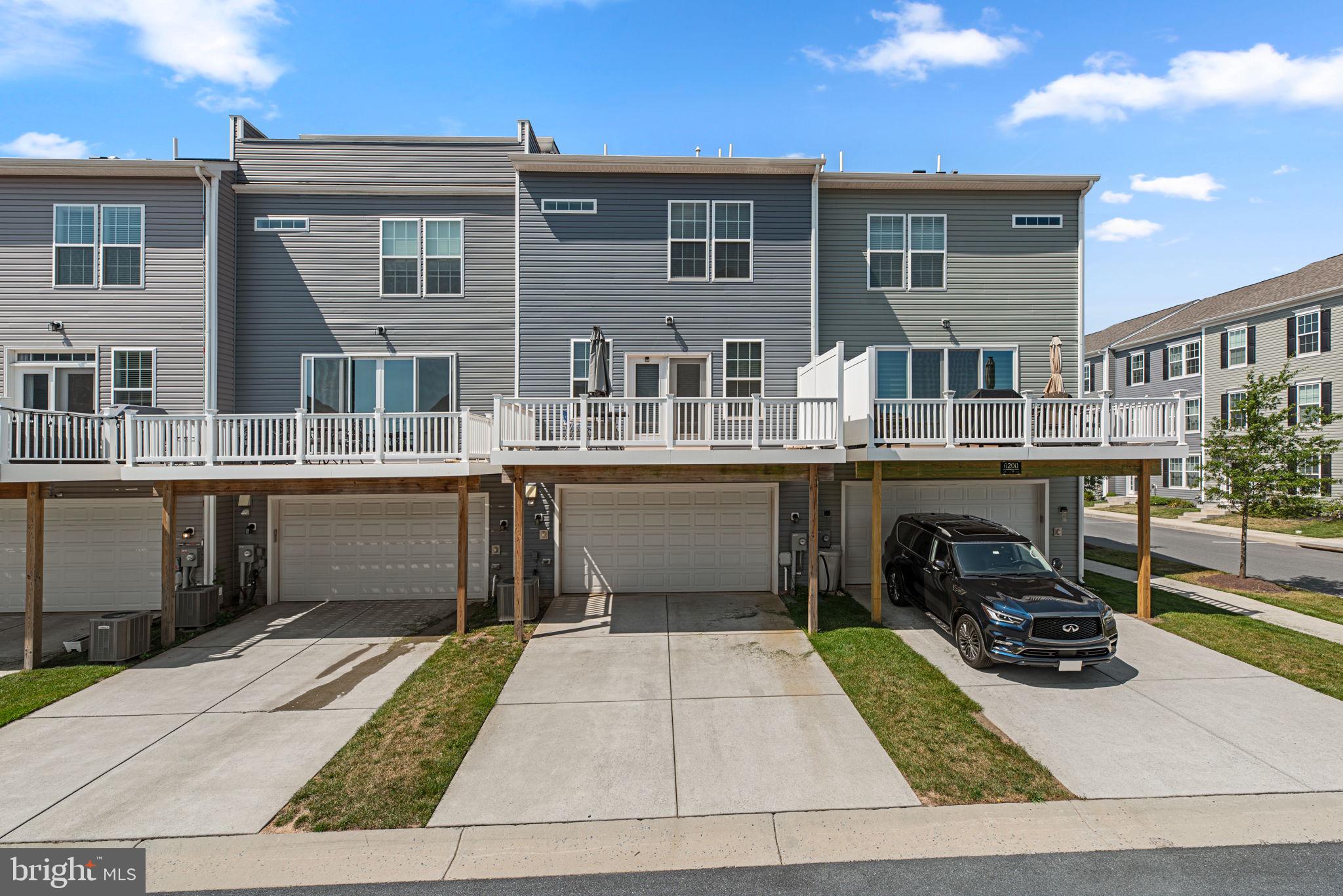 6202 Davinci Street Frederick, MD 21703 - Photo 2 of 3 a view of a brick building with many windows