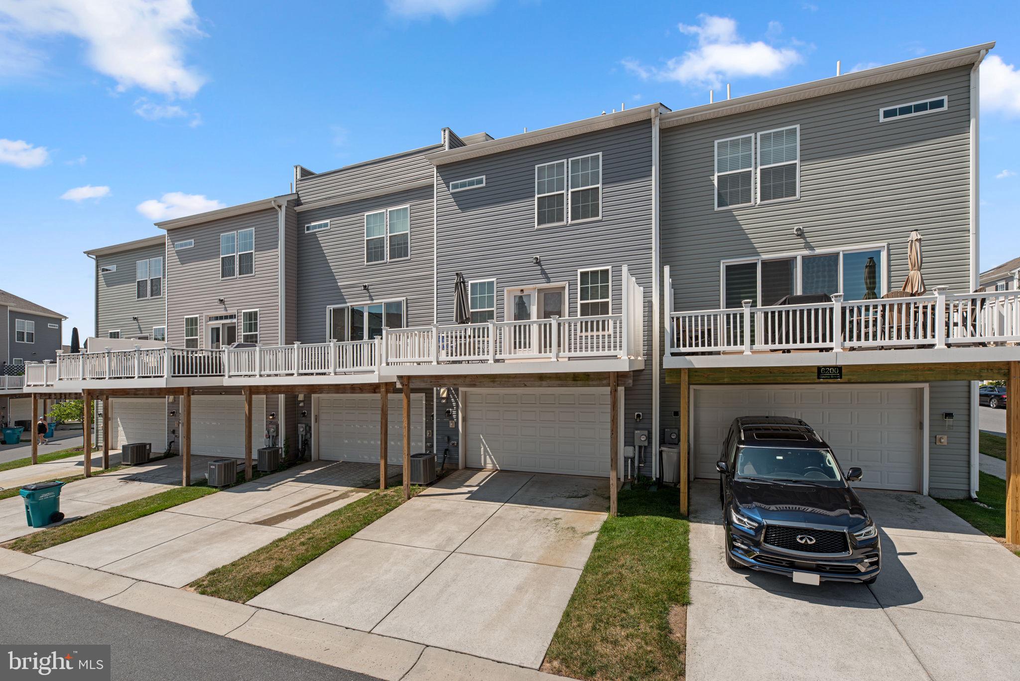 6202 Davinci Street Frederick, MD 21703 - Photo 3 of 3 a front view of a house with a yard
