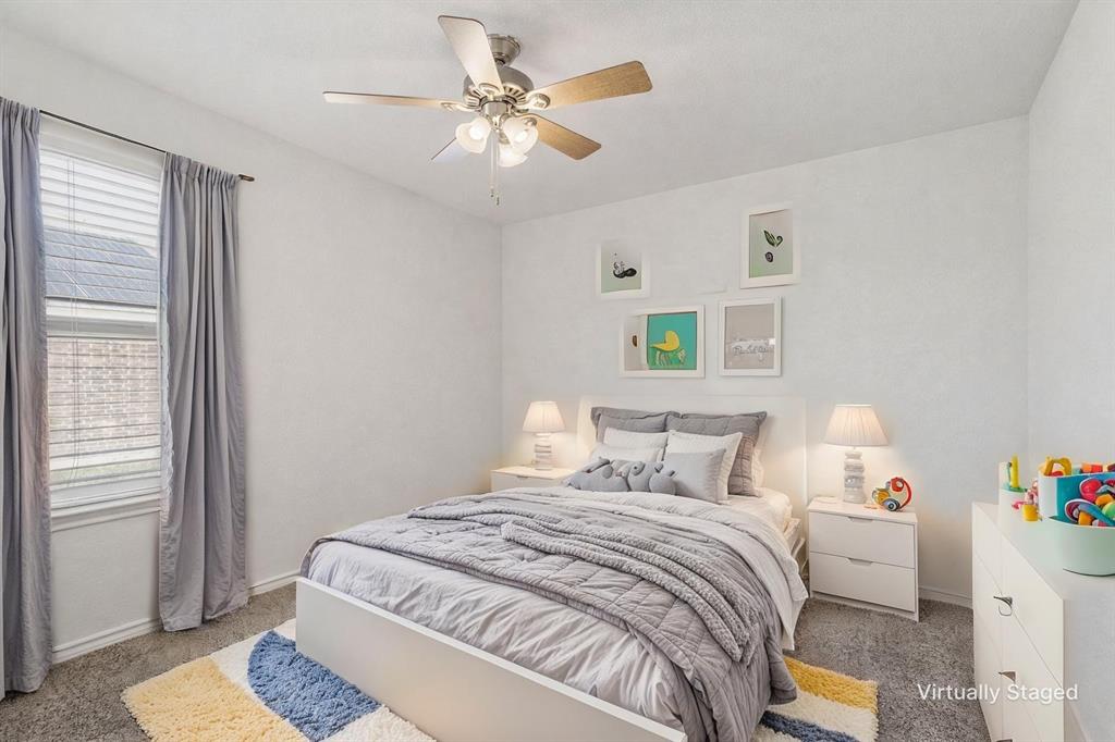 705 Windmill Street Royse City, TX 75189 - Photo 13 of 20 1 of 2 spacious secondary bedrooms.