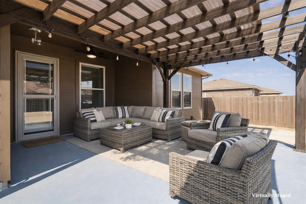 705 Windmill Street Royse City, TX 75189 - Photo 15 of 20 This extended back patio is ready for peaceful coffee watching the sunrise and family dinners full of laughter.