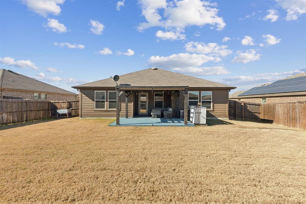 705 Windmill Street Royse City, TX 75189 - Photo 18 of 20 So much back yard space for playful children or furry friends.