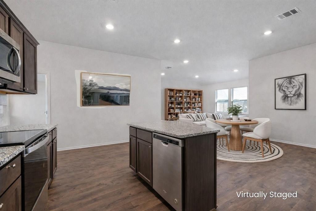 705 Windmill Street Royse City, TX 75189 - Photo 6 of 20 This kitchen with granite counters and stainless steal appliances showcases so much counter and cabinet storage!