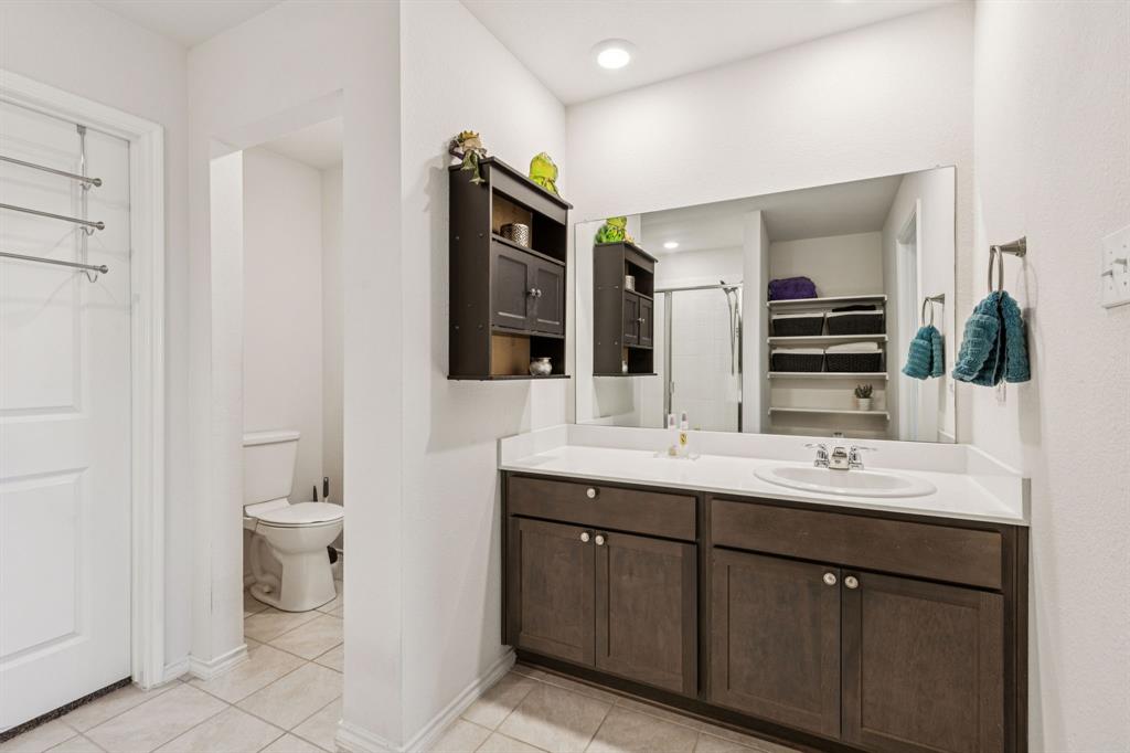 705 Windmill Street Royse City, TX 75189 - Photo 10 of 20 This owner's bathroom boasts massive amounts of storage.