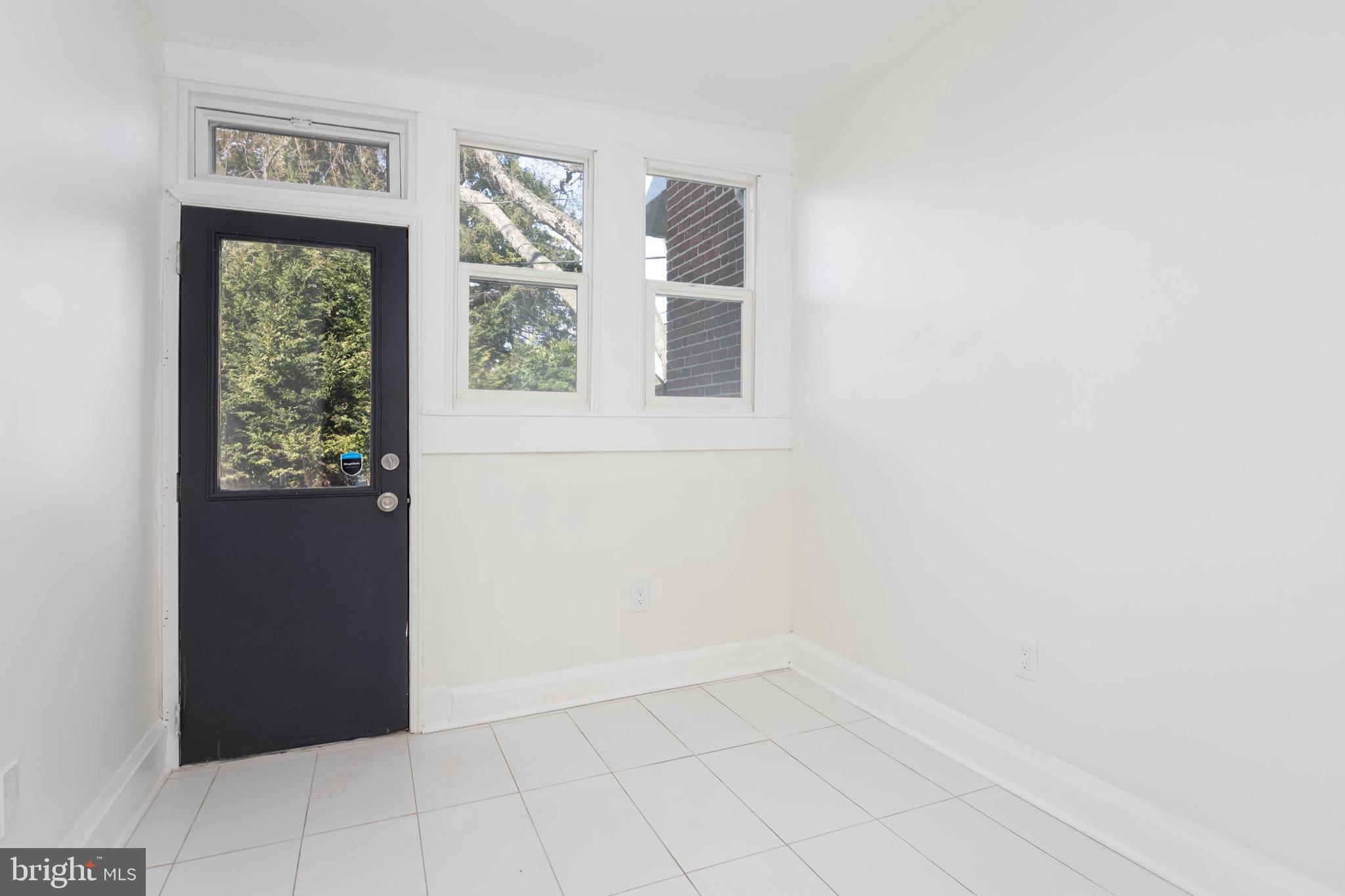 1202 West 42nd Street Baltimore, MD 21211 - Photo 15 of 47 a view of an empty room with a window