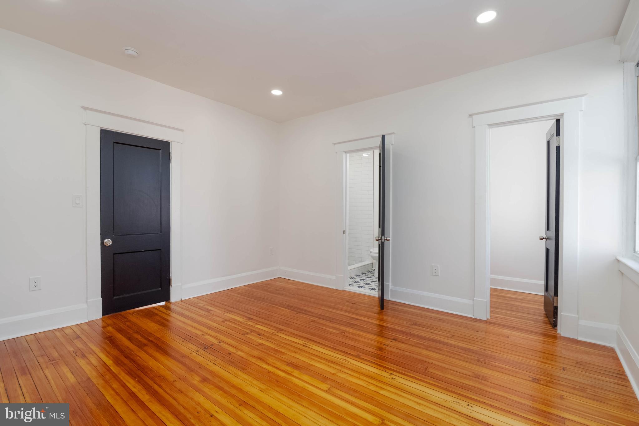 1202 West 42nd Street Baltimore, MD 21211 - Photo 17 of 47 a view of empty room with wooden floor