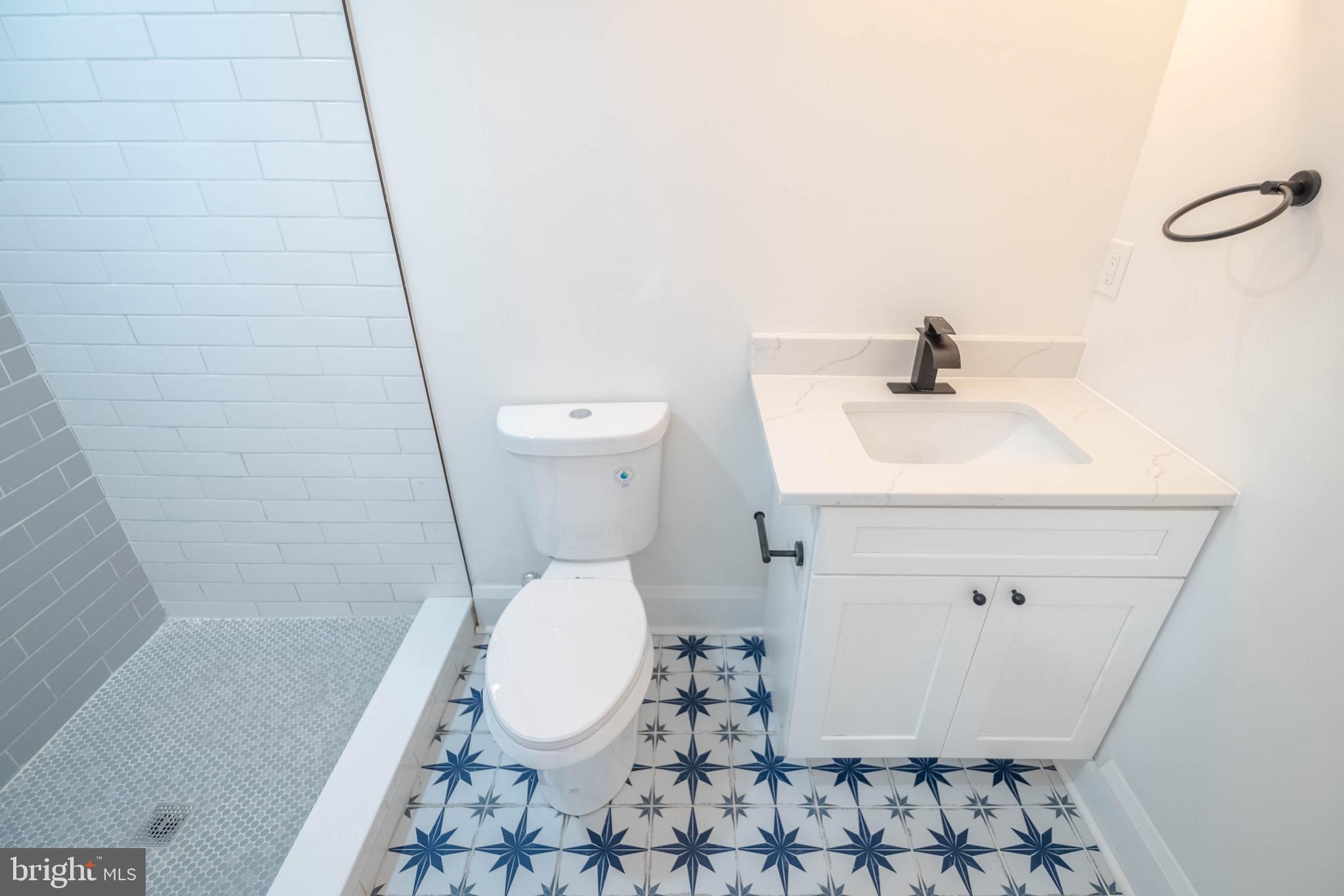 1202 West 42nd Street Baltimore, MD 21211 - Photo 22 of 47 a bathroom with a sink and a toilet
