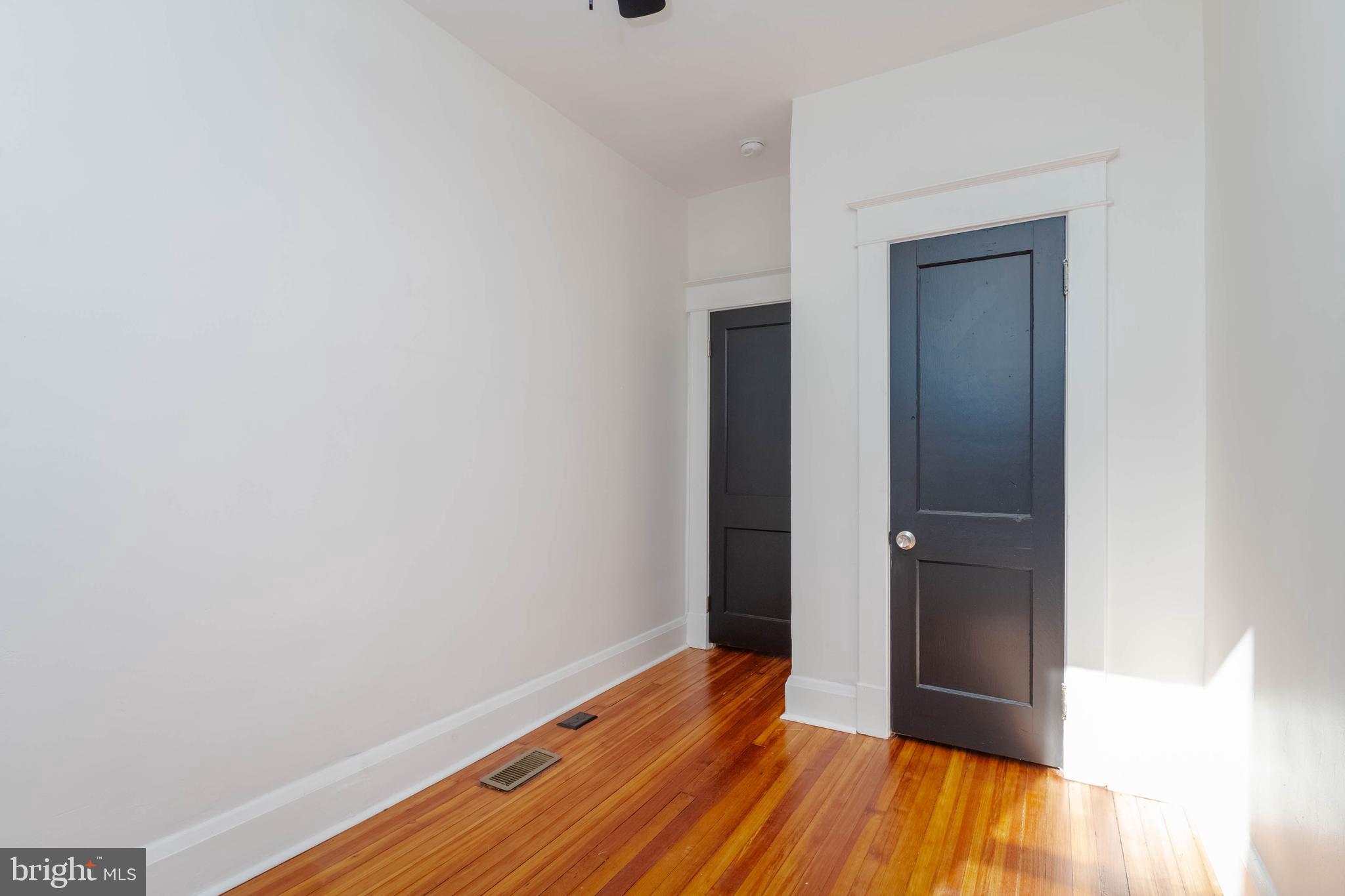 1202 West 42nd Street Baltimore, MD 21211 - Photo 30 of 47 a view of room with wooden floor