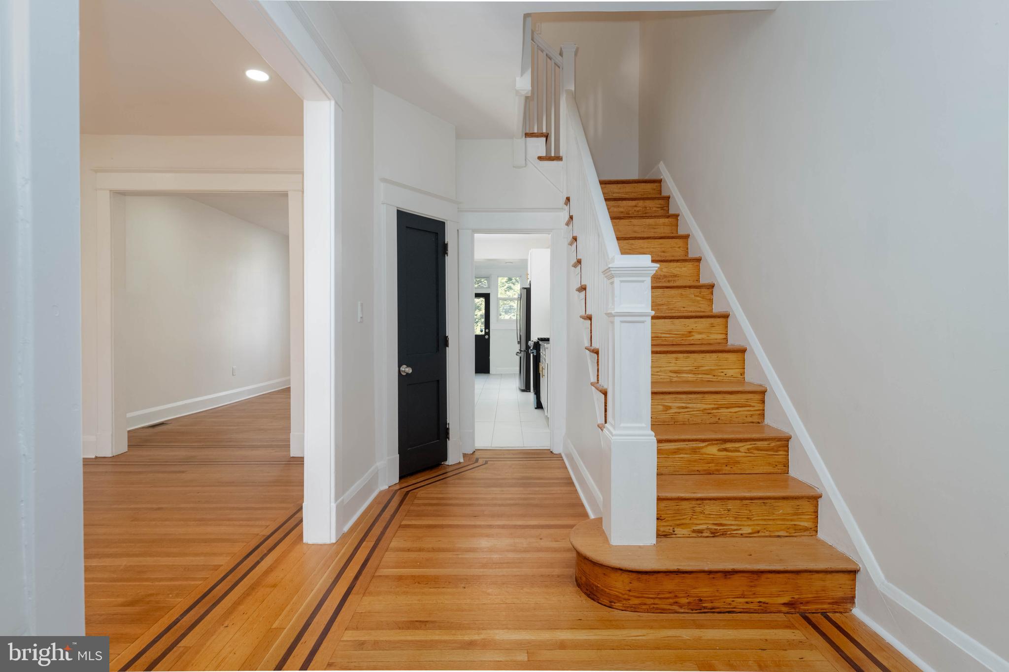 1202 West 42nd Street Baltimore, MD 21211 - Photo 3 of 47 a view of entryway and hall with wooden floor