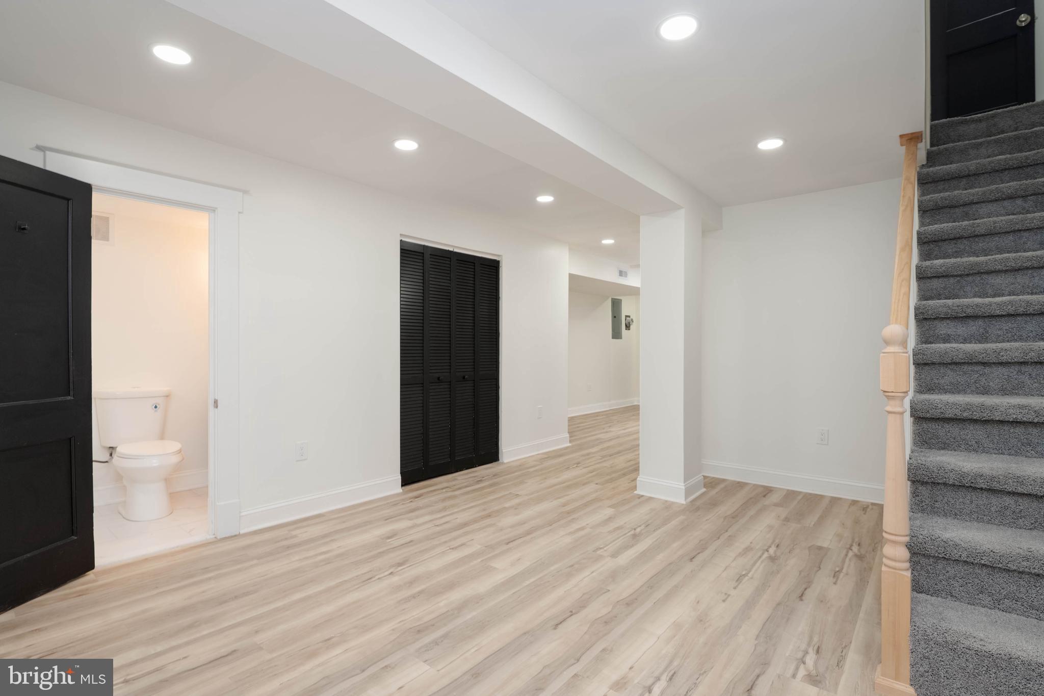 1202 West 42nd Street Baltimore, MD 21211 - Photo 35 of 47 a view of hallway with wooden floor