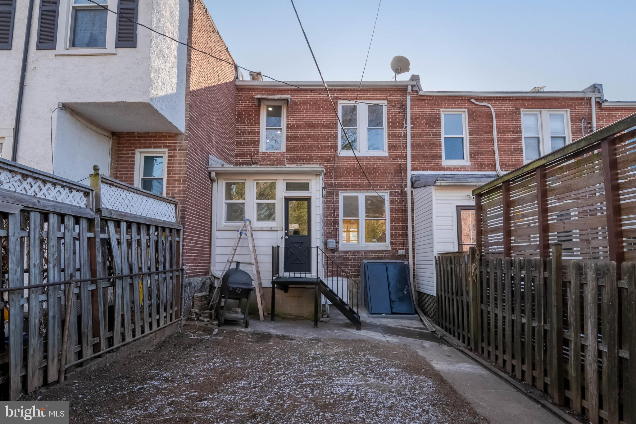1202 West 42nd Street Baltimore, MD 21211 - Photo 42 of 47 a view of a brick house with many windows