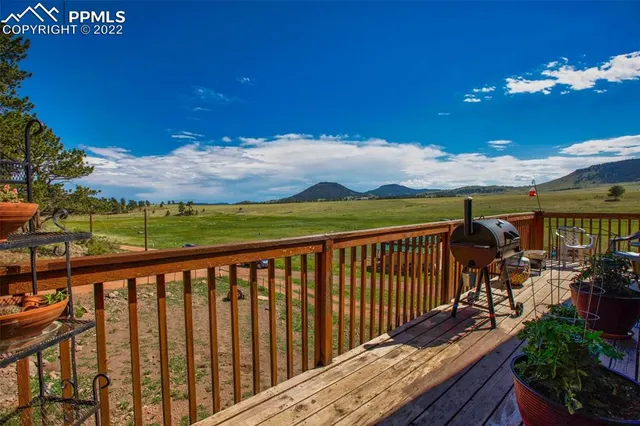 a view of a balcony with furniture