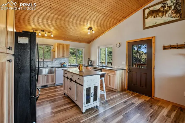 a kitchen with a stove and a refrigerator