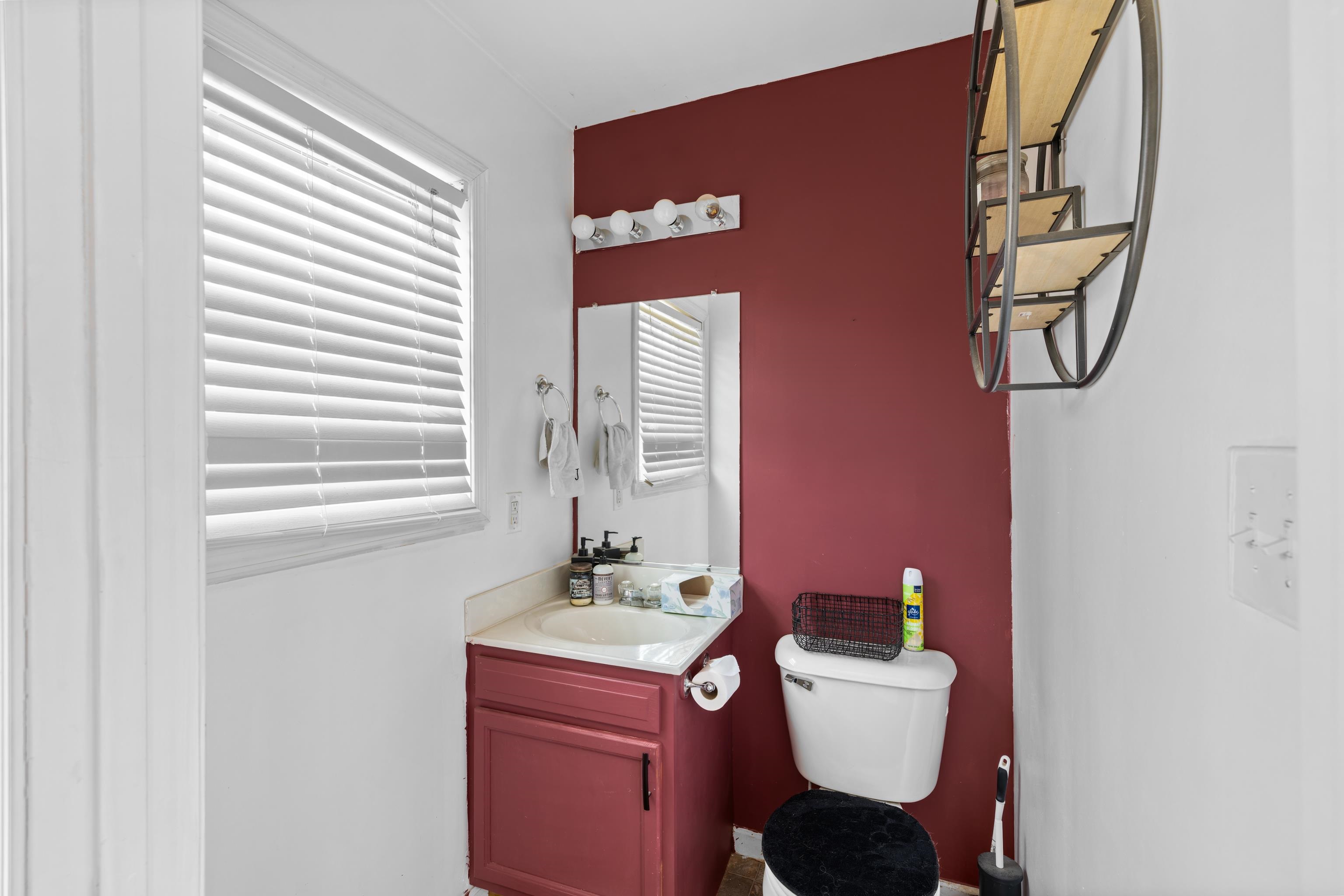 1520 3rd Street Waynesboro, VA 22980 - Photo 33 of 55 a bathroom with a toilet sink and mirror