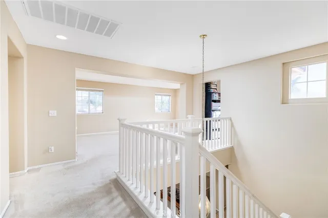 a view of a hallway with windows