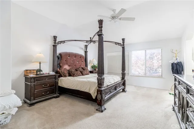 a bedroom with a bed and a table in it