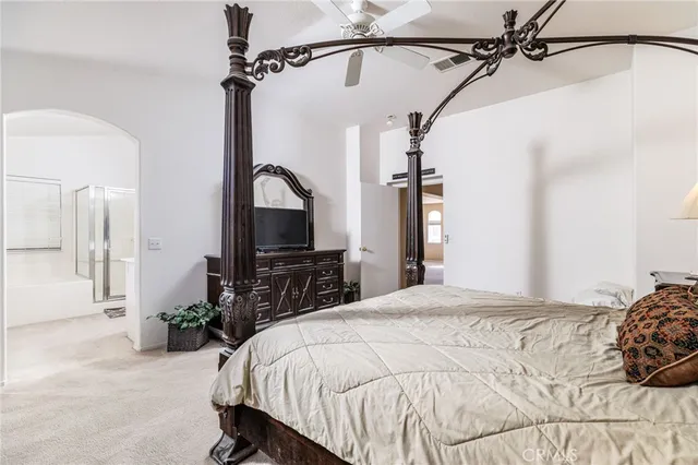 a spacious bathroom with a bathtub sink and mirror