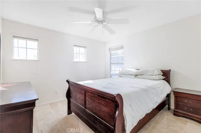 a bathroom with a double vanity sink toilet and a mirror