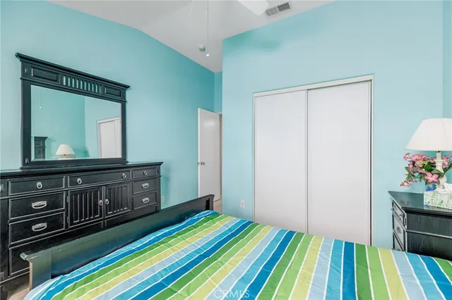 a view of a patio with chairs and a tree