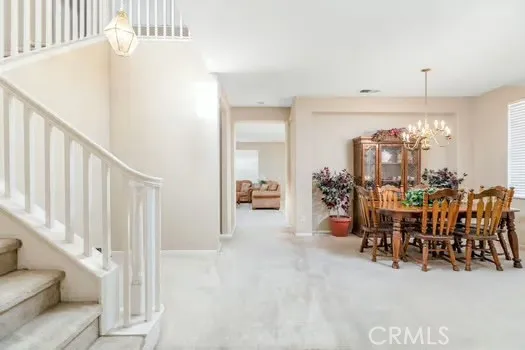 a view of a livingroom with furniture and white walls