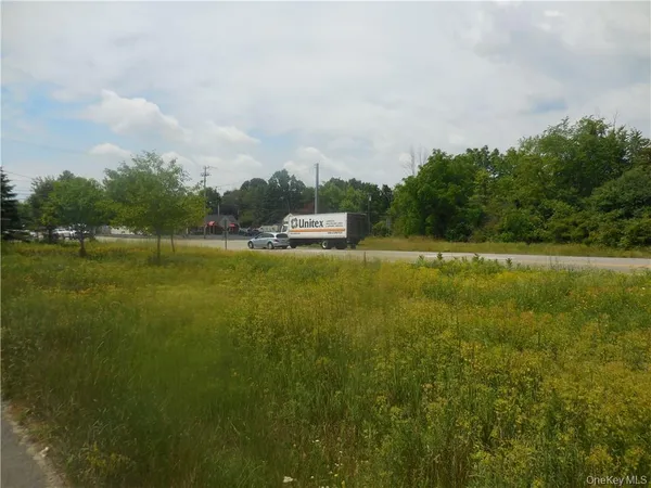 a view of lake with green space