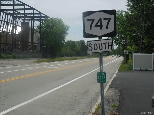 a street sign on a street next to a road