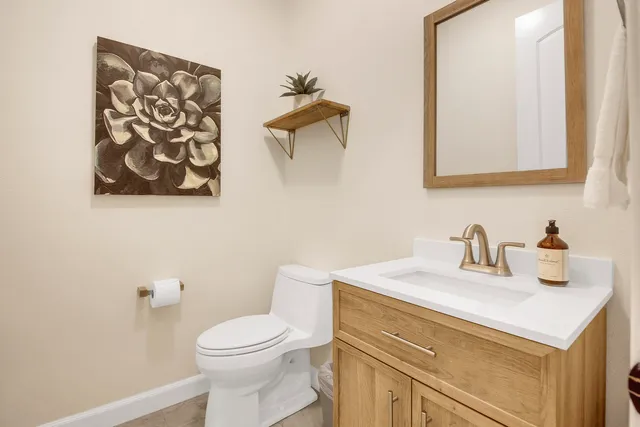 a room with a sink and cabinets