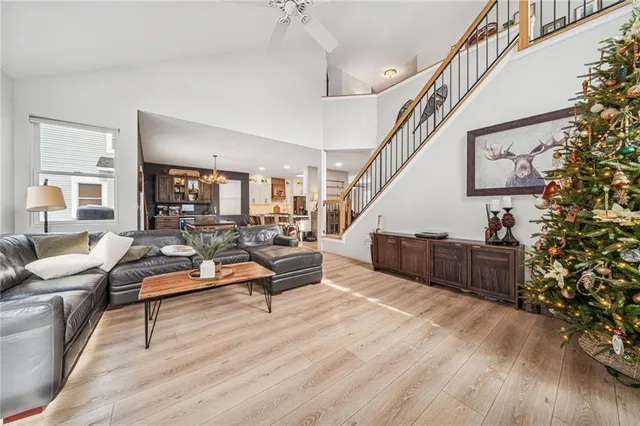 a living room with furniture and kitchen view