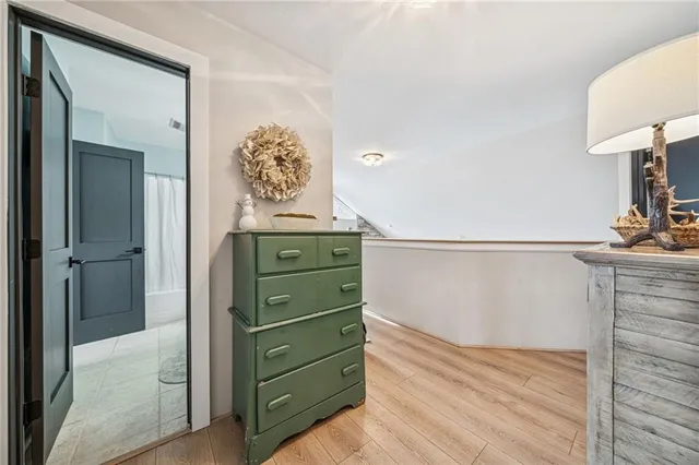 a bedroom with a bed and ceiling fan