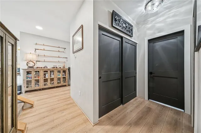 a bathroom with a sink mirror vanity and toilet