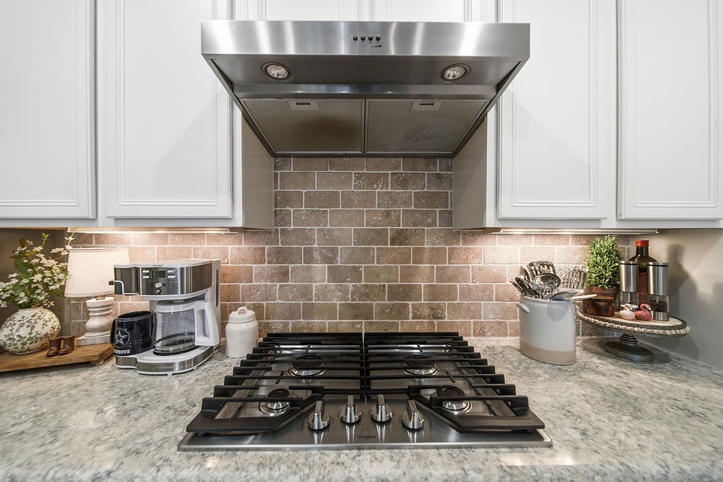 9614 Carson Lane Iowa Colony, TX 77583 - Photo 16 of 50 Gas cooktop with beautiful, tumbled stone subway tile backsplash!