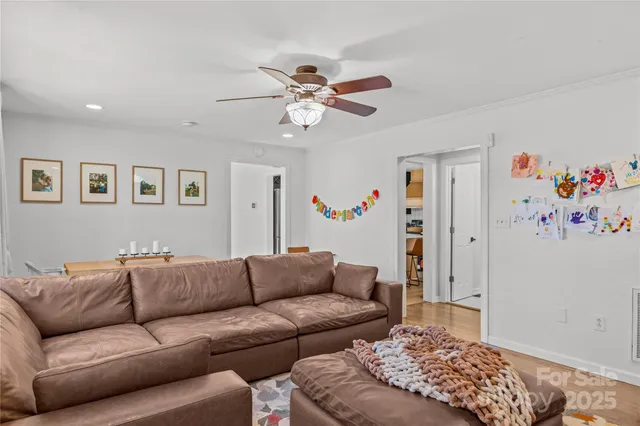 a living room with furniture and a bed