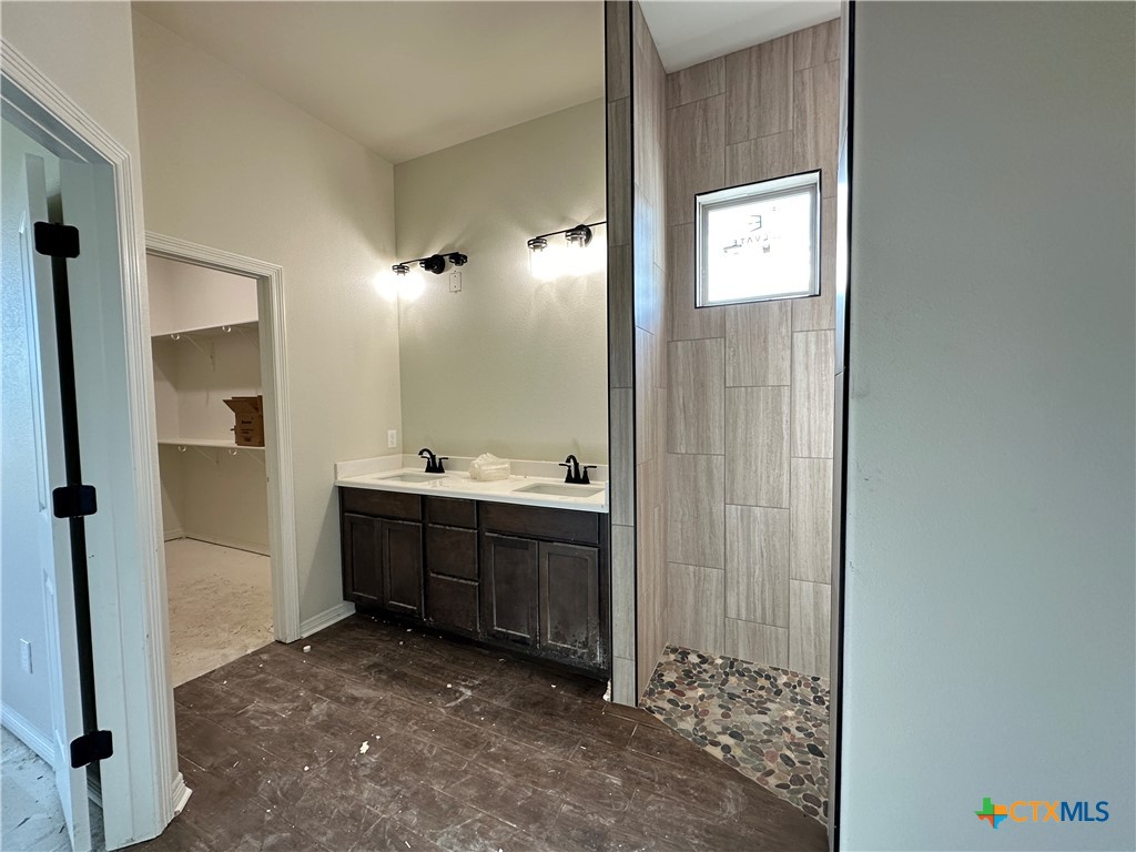 4417 Agave Trail Temple, TX 76502 - Photo 14 of 19 a bathroom with a sink and a mirror
