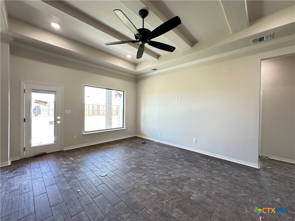 4417 Agave Trail Temple, TX 76502 - Photo 5 of 19 an empty room with wooden floor fan and windows