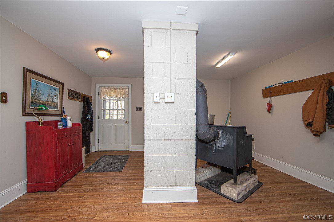 2729 Judes Ferry Road Powhatan, VA 23139 - Photo 29 of 50 The basement has a back foyer and a wood stove if someone wishes to use it.