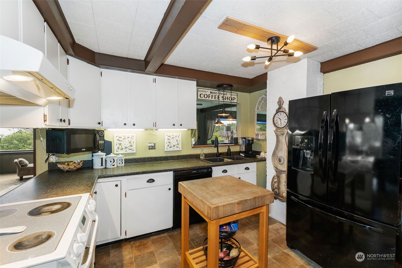 7911 East Maple Street Port Orchard, WA 98366 - Photo 16 of 39 a kitchen with a sink appliances and cabinets