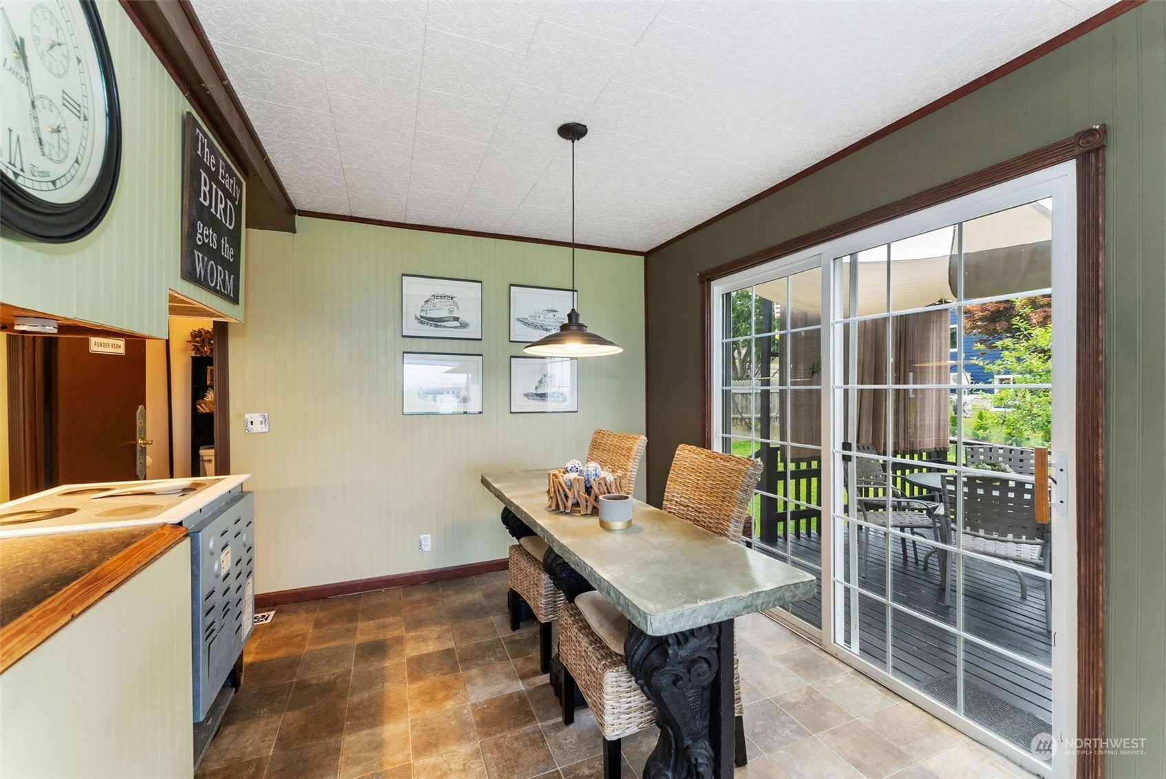 7911 East Maple Street Port Orchard, WA 98366 - Photo 20 of 39 a view of a room that has a couch and a table in it