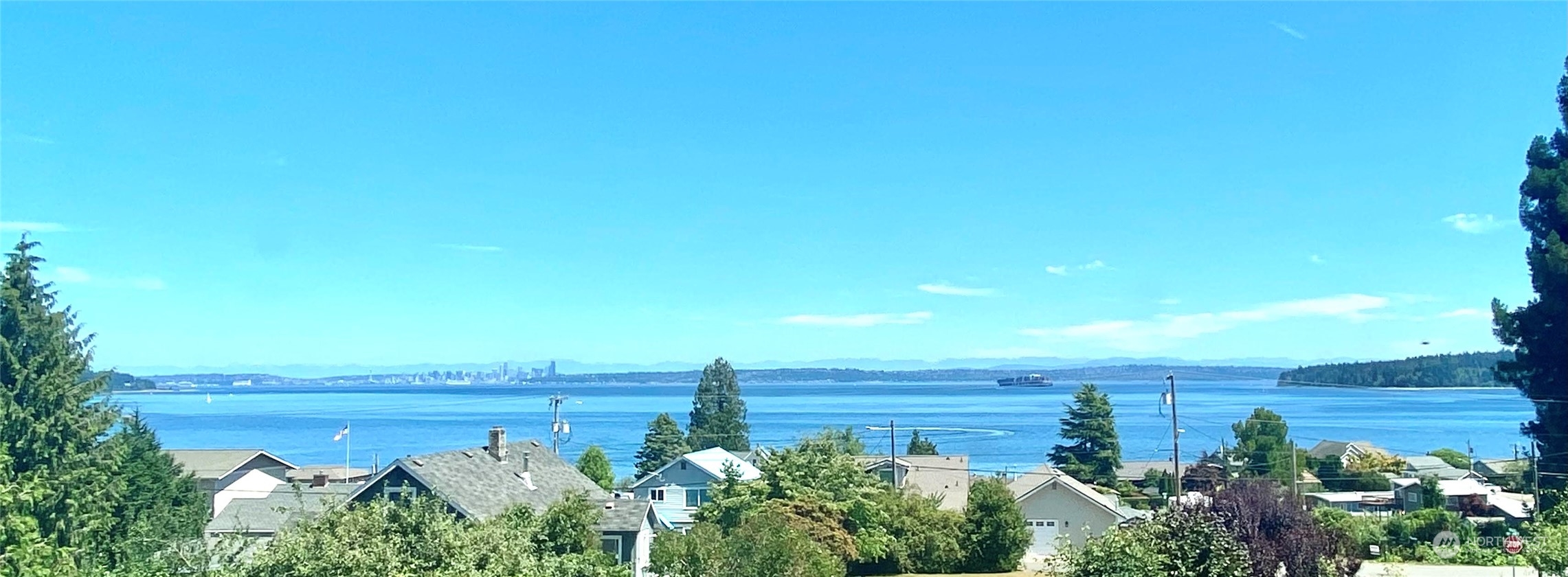 7911 East Maple Street Port Orchard, WA 98366 - Photo 2 of 39 a view of a yard and an ocean
