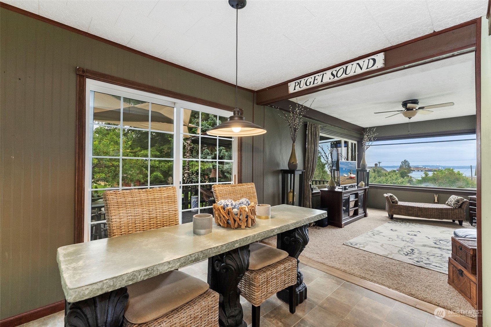 7911 East Maple Street Port Orchard, WA 98366 - Photo 21 of 39 a view of a dining room with furniture window and outside view