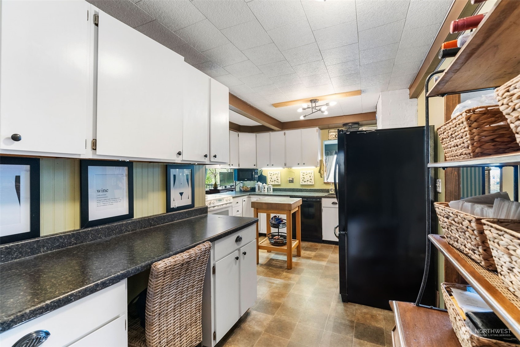 7911 East Maple Street Port Orchard, WA 98366 - Photo 22 of 39 a kitchen with stainless steel appliances granite countertop a refrigerator a sink and a stove